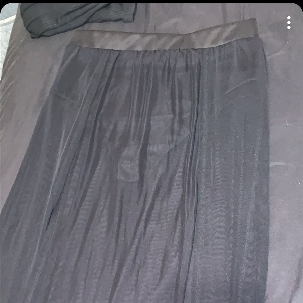 A black mesh skirt with slits